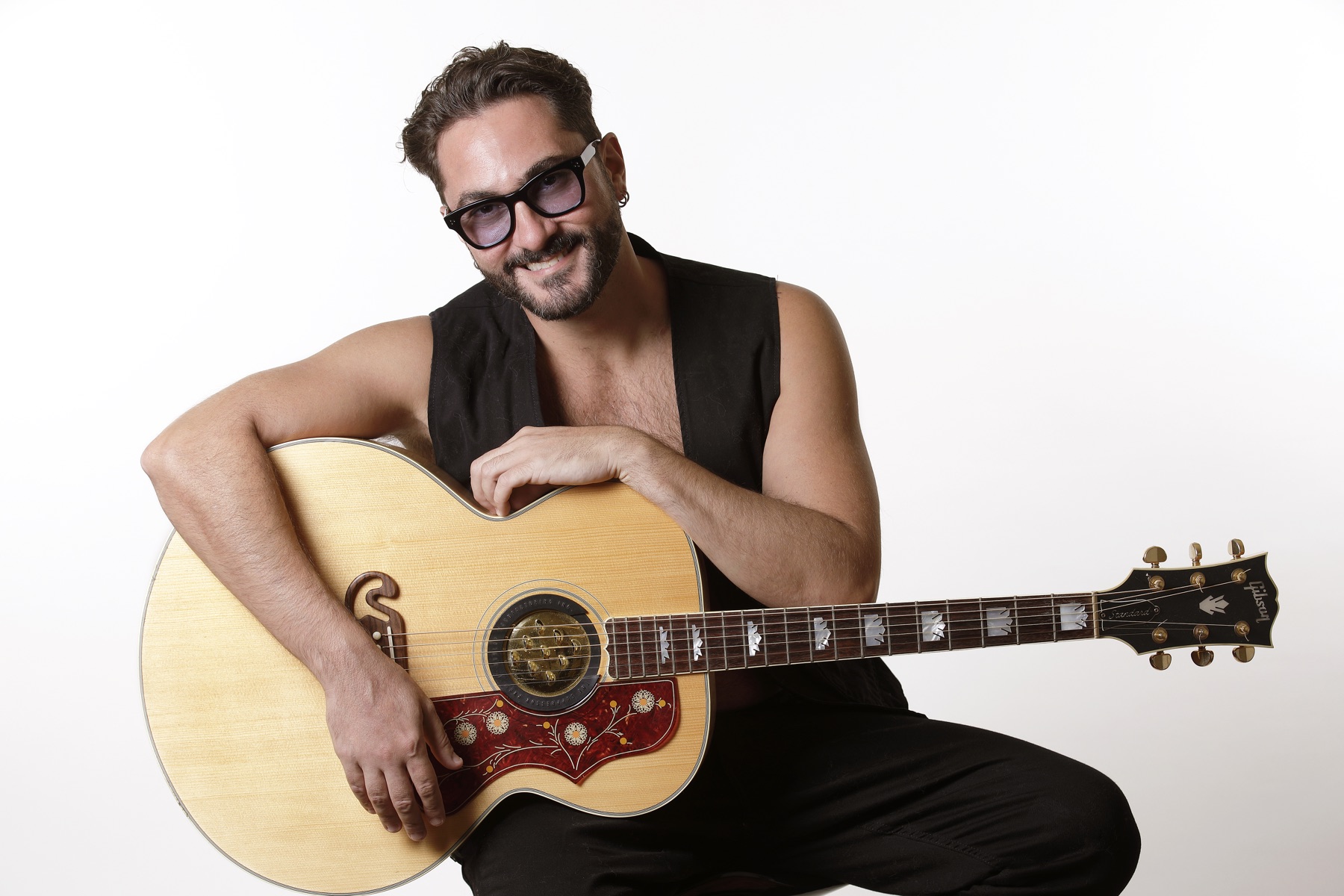 Stefano Eliamo with an acoustic guitar