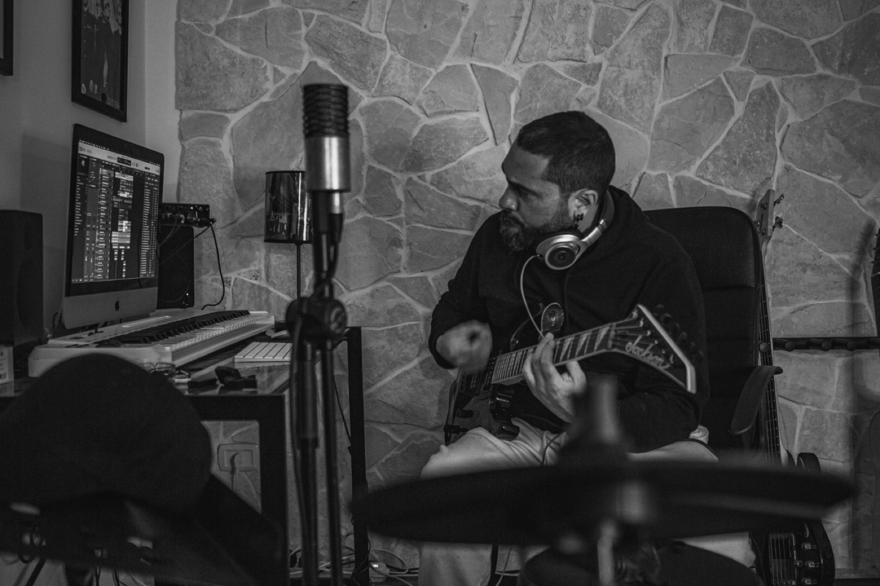 Stefano Eliamo recording electric guitar in his studio